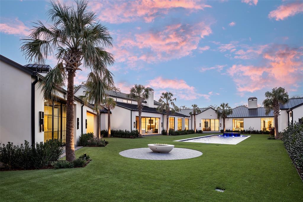 Just completed new construction by Crescent Estates behind a walled and gated 1.8-acre estate in the heart of Old Preston Hollow offers a resort-style experience in one’s own backyard. Primarily one-level home with sleek modern design, warm transitional finishes & an incredible U-shaped floor plan is ideal for entertaining and everyday living. Vaulted great room with chef’s kitchen opens onto one of multiple covered terraces, all overlooking the 42-ft pool, spa and regulation sized lighted tennis court. Opposite is the primary wing including a sitting area, gym, large walk-in closets and dual spa-like bathrooms flanking a private courtyard - perfect for a cold plunge, private hot tub or garden. Three ensuite bedrooms and a playroom are on an adjacent wing. A private two-room suite is located through an open-air loggia & connects to an entertainment pavilion with fireplace and fully-equipped kitchen. Upstairs is a two-bedroom suite with living room and kitchen, ideal for multigenerational living or au pairs. Car enthusiasts will love the oversized 6-car garage with motor court area. Extensive, mature landscaping in the heart of one of Dallas’ most exclusive neighbors create one best new construction opportunities available.