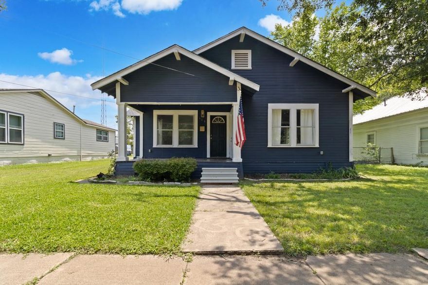 Incredible opportunity to own your first home in Groesbeck!  This fabulous two bedroom, one bathroom craftsman-style home is adorable with navy exterior and brass finishes.  The covered front porch is inviting for that morning cup of coffee and watching the sunrise.  On the interior, there are high ceilings with shiplap accents and original hardwood floors throughout the majority.  The home has central AC and heat that was installed recently. The kitchen has a peninsula with granite countertops and is furnished with plenty of storage.  The bathroom underwent renovation just a few years ago.  There are large walk-in closets and a separate laundry room area as well as pantry.  Around back, there is access to the two-car carport and would make a lovely backyard once fenced.  Additionally, this is a great location and is just around the corner from restaurants and shopping.  Home is priced to sell and ready for your personal touches!
*Some photographs have been virtually staged for enhancement.