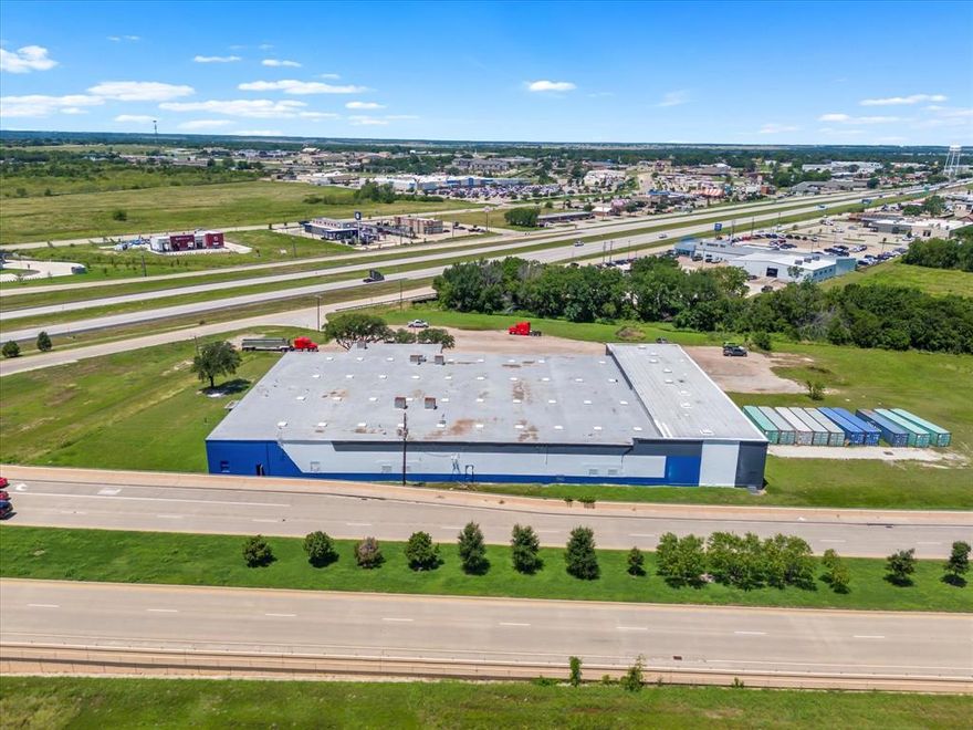 It's all about the location and this property has it. This 43,020 sq ft warehouse along with 8+ acres is located on the corner of 175 in Kaufman just minutes away from either HWY 20, HWY 30 and HWY 635 which can get you into the Dallas metroplex in under an hour. This newly painted warehouse has upgraded electrical panels and a new roof within the past year. The warehouse is ready for your business to move right in with 3 full size bay doors
2 manual and 1 motor chain as well as a dock plate for easy deliveries. The large 8+ acre lot makes it easy for semi trucks to deliver and park if needed the city has this parcel zoned Real Industrial (NEC). Come be a part of Kaufman County which has been named by the US Census Bureau as the fastest-growing county over 100,000 in the nation.