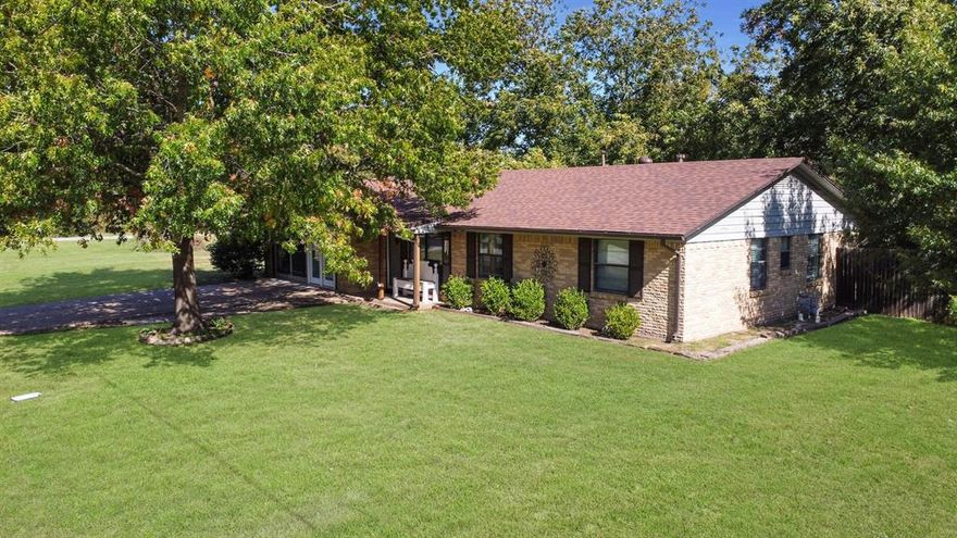 Welcome home to almost half an acre with mature trees; The home has 3 bedrooms and 2 updated bathrooms with 2 living areas; the kitchen has tons of cabinets, builtin microwave, cooktop, builtin oven and large dining area for hosting holidays; master bedroom has custom paint, ceiling fan, natural light and ensuite; the ensuite has been remodeled and has overly large shower with bench seating, ceramic tile flooring and updated cabinetry; two guest rooms with guest bathroom that has had some updates; Second living can be bedroom, game room for family, or home office; you have plenty of room on the property to entertain family and friends; fenced in backyard with covered patio and firepit!