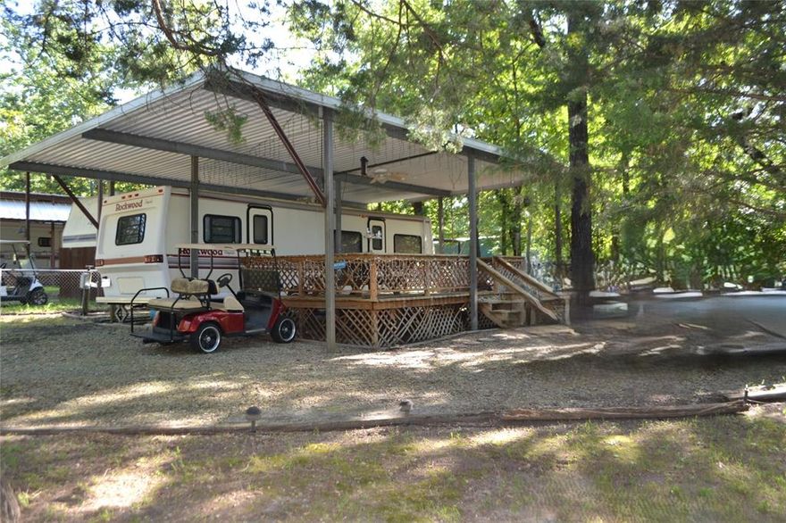 Two fenced lots in Sun Eagle Bay offer the perfect weekend escape or affordable Lake Fork retreat! This property includes a 
1991 Rockwood Royale RV that’s been protected under a metal awning and features a queen bed, sofa, chair, breakfast table, built-in microwave, and an upgraded full-size refrigerator and freezer. Step outside to enjoy a spacious covered wood deck with a picnic table, ceiling fan, and plenty of shade from tall, manicured trees. The two lots are fully enclosed with chain link fencing for privacy and security. A storage shed and outdoor grill add functionality for extended stays or gatherings. Sun Eagle Bay amenities include a boat ramp, fishing pier, swimming pool, clubhouse, and playground. Enjoy direct access to Lake Fork—just named the #3 bass fishing lake in the nation by Bassmaster. Whether you're looking to unwind, fish, or entertain, this property is ready to go!