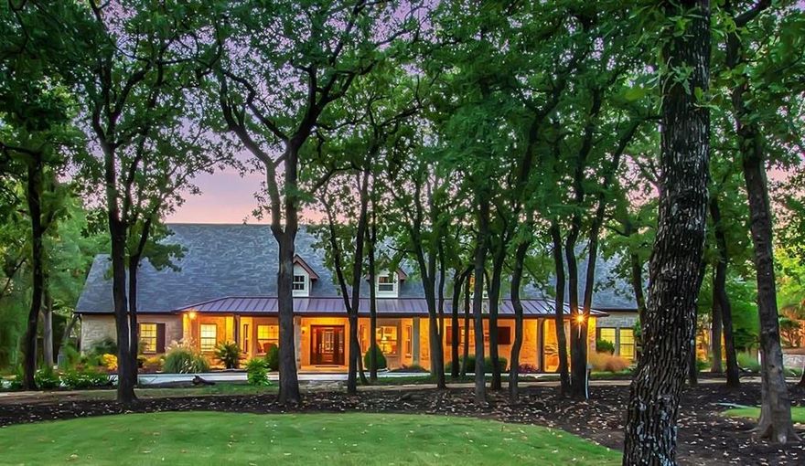 Stunning 2-Acre Gated ranch style home with a fully finished 1,000 sq. ft. guest house with a kitchen, full bath, living room, and bedroom, perfect for multi-generational living or rental income. A detached 30x60 1,800 sq. ft. shop with an RV-height door is fully insulated and equipped with plumbing, electric, and HVAC, offering endless possibilities. Beautifully landscaped 2-acre lot adorned with mature oak trees, this gated property offers luxury, functionality, and versatility. A circular driveway welcomes you to the main residence, a thoughtfully designed 4-bedroom, 4-bath home with energy-efficient features, including foam insulation, a Class 4 shingle roof (2021), a water filtration system, and a tankless water heater. The primary suite is a true retreat, boasting a stone gas fireplace, a freestanding tub, a walk-in shower, heated floors, custom Alderwood cabinets, and a walk-in closet with a pull-down clothes rack. The kitchen is a chef’s dream, complete with granite countertops, stainless steel appliances, a gas cooktop, a second sink, and custom Alderwood cabinetry. Entertain effortlessly with an outdoor kitchen featuring a pergola, stone fireplace, grill, hot tub, and expansive patio space.  Horses are welcome, and the home is located within the highly sought-after Keller ISD. Country living but just minutes away from city amenities. Don’t miss the chance to own this exceptional property with NO HOA!