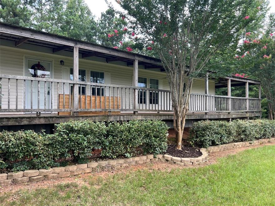 2.16 Acres with asphalt drive from the road to the 3 bedroom, 2 bath double-wide manufactured home. Handicap accessible.  Living room, Den with a wood-burning  fireplace, bonus room could be an office, open floor plan, kitchen is spacious with lots of cabinet and counter space. Storm windows are tilt-in easy to clean windows. Very clean, well kept property. 24x41 Workshop on concrete with electricity and attached double car carport. The Metal roof was installed in 2010, water heater 2022, and tankless water heater, also. Fridge, washer and dryer remain.  MINERALS RESERVED.