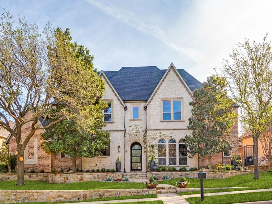 Gorgeous Starwood home full of luxury and thoughtful touches! Entry welcomes with dramatic staircase, leading into formal living, accented by elegant crown molding, floor-to-ceiling windows, and stately fireplace. Chic dining room features beautiful chandelier and custom drapery, bringing elegance to special occasions. Handsome study boasts hardwoods throughout and connected to 1300-bottle climate-controlled wine cellar. Remodeled kitchen is a chef’s dream, with stunning quartzite waterfall island, Wolf 4-burner gas cooktop, double ovens, warming drawer, and SubZero refrigerator. Generous built-ins, highlighted by LED backlighting offer ample storage, while walk-in pantry and additional workstation with extra sink make entertaining easy. Expansive den flows easily from kitchen, boasting generous natural lighting, numerous built-ins, and sleek wood-burning fireplace. Primary features unique recessed ceiling with lighting and roomy sitting area. Relaxing primary bath includes dual vanities, garden hydrotub, and separate shower with body sprays. Custom walk-in closet system offers generous built-ins to stay organized and cedar closet. Oversized game room accented by striking wood ceiling and balcony access, with wet bar and connection to 2nd upstairs utility room. Movie nights are a delight in spacious media room. All secondary bedrooms offer ensuite baths and walk-in closets. Upstairs bonus room has built-ins, including desks, making it perfect as additional study, gaming space or craft room. Backyard oasis is perfect for outdoor living, with covered patio that features built-in Lynx gas grill, built-in heater, and remote-controlled screens. Shimmering saltwater pool and spa include pool chiller, perfect for hot summer days. Epic pool parties await with built-in bar and spacious concrete decking and yard that offer ample space to spread out and entertain. Additional features include whole-house generator, LED lighting throughout, and mosquito mist system.