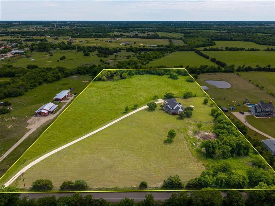 Tucked far back off the road behind a gated entrance this private country retreat offers the space,freedom and lifestyle buyers dream about -room to roam,relax,entertain and truly enjoy the outdoors.Situated on 10.46 acres w-an Ag exemption already in place this property is ready for all your four-legged friends,horses,cows,4-wheelers,dirt bikes and plenty of space for kids to run,explore or fish in the pond.Fenced and cross-fenced provides flexibility for animals,recreation or simply enjoying wide-open country living.Spend evenings around a fire pit,host cookouts w-family and friends or unwind on the covered front and back porches while taking in peaceful sunrises and sunsets overlooking the countryside.

Custom-built home features soaring ceilings and an open-concept design that creates a spacious and inviting atmosphere.Inside you’ll find 4 beds,3.5 baths and an impressive living room w-dramatic 20-foot ceilings, abundant natural light and a cozy wood-burning fireplace.Kitchen offers generous prep space,island,granite countertops and excellent flow for entertaining along with updated appliances including a Oven with air fryer and convection 2024  microwave 2024 and dishwasher 2023.A  window above the sink showcases beautiful views.Primary suite has been refreshed w-updated paint an updated ceiling fan.Ensuite Bath w-dual vanities,separate tub and an updated Shower.Versatile layout with both Primary and a secondary bedroom with en-suite bath located downstairs perfect for multigenerational living or private guest accommodations. 

Thoughtful recent improvements provide added peace of mind including Roof 2024,2 HVAC systems 2020 and 1 in 2026,garage door 2025, carpet  2026,plus fresh interior and exterior paint and updated exterior light fixtures 2026.

With mature trees wide-open views exceptional privacy from the road and convenient access to nearby town amenities this property offers the perfect balance of peaceful rural living and everyday convenience.