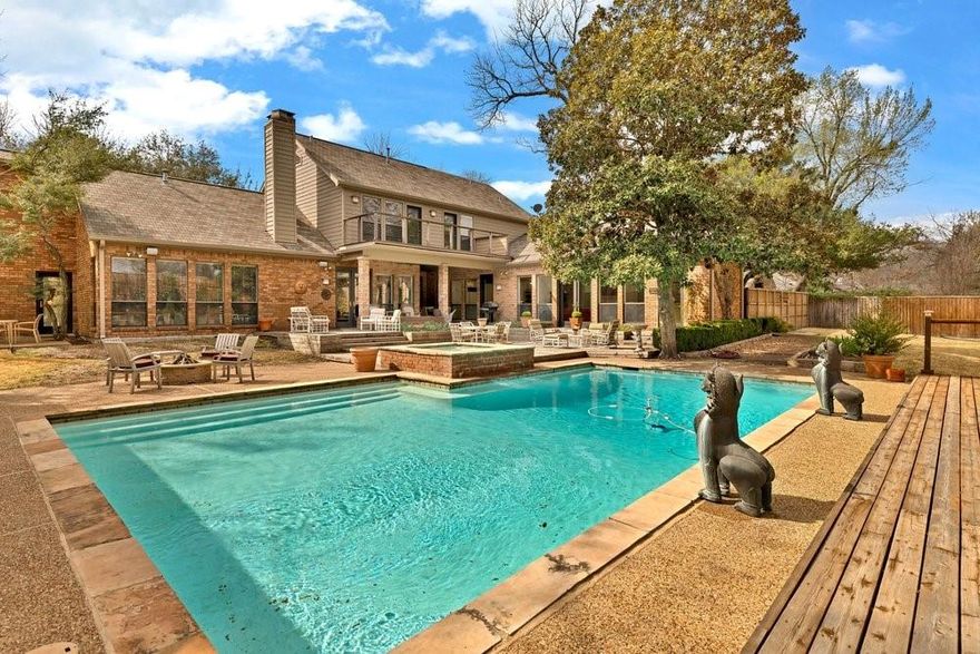 Exceptional opportunity in Janmar Circle, one of Dallas’ most sought-after neighborhoods, with no HOA. Situated on a 0.63-acre lot along a wide tree-lined street, this 4,388 SF home offers privacy, space, and timeless appeal. Abundant natural light fills the well-designed floor plan featuring 4 beds and 6 baths, formal living and dining areas, three fireplaces, and a spacious den with a wet bar. The first-level primary suite provides comfort and convenience, while the second-level includes a versatile flex space, two additional bedrooms with en-suite baths, and a balcony overlooking the backyard. Designed for both grand-scale entertaining and intimate gatherings, the backyard is a true showpiece. Enjoy a resort-style pool with an attached spa, expansive decking, multiple seating areas, and an elegant covered pavilion. Professionally landscaped front and rear grounds enhance the home’s private outdoor setting. Notable upgrades include a gas fire pit, 3 outdoor ceiling fans, 22 perimeter lights with timers, security system including motion detectors and glass breaks, fresh interior paint, foundation repair, new water heaters, new driveway, sump pumps in the front and rear yards, and epoxy flooring in the three-car garage. Meticulously maintained and ideally located near top-rated private schools, premier shopping and dining, this home is ready with the option to enjoy as-is, renovate, or build custom.