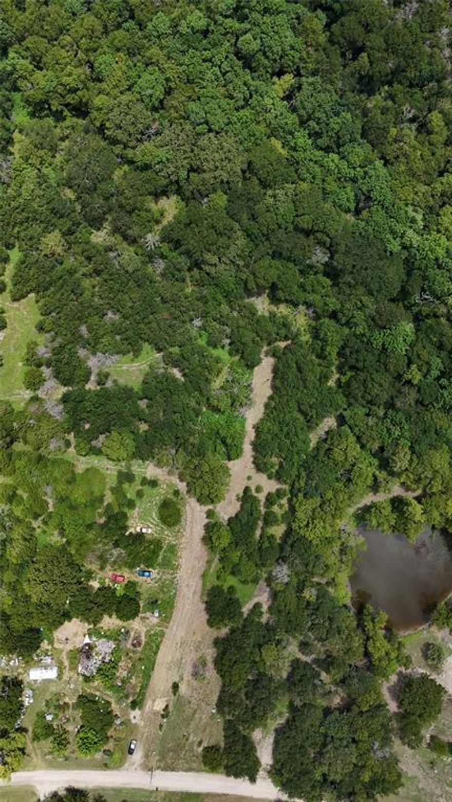 Looking for a lot where you can do as you please? Welcome to this 1.01 acred lot outside of Quinlan city limits, this property has zero restrictions and is ready for whatever you envision! Heavily treed and private, this lot offers a serene environment perfect to build a single family home in or to install your mobile home. Along with that, most of the perimeter of the lot is fenced and you have easy utility access to water and electricity services!