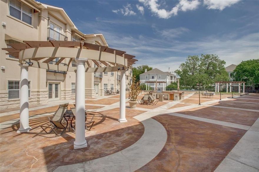 EASY LIVING & PRICED MOVEIN READY - Gated & Secure unit located on 2nd floor over looking the Piazza. Hand-scraped hardwood floors in the kitchen & living room. Granite countertops in the kitchen & bath. Large bedroom & huge walk-in-closet. Parking is covered, assigned & gated. SS appliances & stove has only been used 2x since installed. Trash chute at the end of the hall. Lap pool. Clubhouse available to rent out for events.