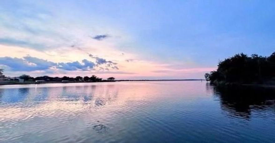 Well-maintained, one owner, 2 bedrooms, 2 bathroom home, situated on a 50’ x 150’ lot in the gated community of Holiday Villages of Lake Fork, features an extended deck leading to a cozy covered porch, extended driveway, with a carport, with beautiful crape myrtles lining the property. 

This property offers direct access to a well known popular lake of Lake Fork, this beautiful lake is ranked third in the Bassmaters magazine list, of the best bass lakes of 2025. You will have access to the private boat ramp and fishing pier, plus community perks like a saltwater pool, fishing ponds, clubhouse, putt-putt, and more!

The neighboring lot is currently for sale as well, offering a rare opportunity to purchase both properties in separate transactions and create additional space or future potential.

Community amenities include gated entry, fishing piers, boat ramps, clubhouse, saltwater pool, playground, mini golf, basketball court, and picnic tables.  This community is perfect for full-time living, weekend getaways, or investment opportunities.