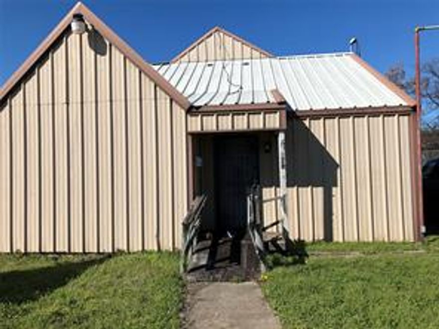 Selling As-Is Condition- Formely Dance Studio and School.  Although tax roll has it a one-story this is a two-story building with two bathrooms, a kitchen, office area, a huge dance studio downstairs and a second dance room upstairs.