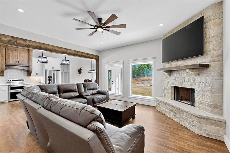 Nestled in the sought-after Mountain Lakes community, this retreat offers the perfect blend of luxury, comfort, and connection. Set atop a scenic hill, the home boasts breathtaking views and thoughtful design details throughout. Step inside to find LVP flooring, built-in shelving, and a cozy wood-burning fireplace that anchors the living space. The chef’s kitchen is equipped with KitchenAid appliances, double ovens, a large walk in pantry, and a butler’s prep area, ideal for both entertaining and everyday use. The primary suite features vaulted ceilings, spacious walk in closets, and even direct laundry access for added convenience. Additional highlights include a mudroom, water softener system, and newer Maytag washer and dryer. Crafted by the renowned Braun family, this home showcases exceptional craftsmanship and attention to detail. The vibrant neighborhood offers two lakes designed by legendary bass fisherman Jimmy Houston, one for jet skiing and another for fishing, along with frequent community events that make every day feel special. PLUS, all furniture, appliances, and non-realty items are negotiable!