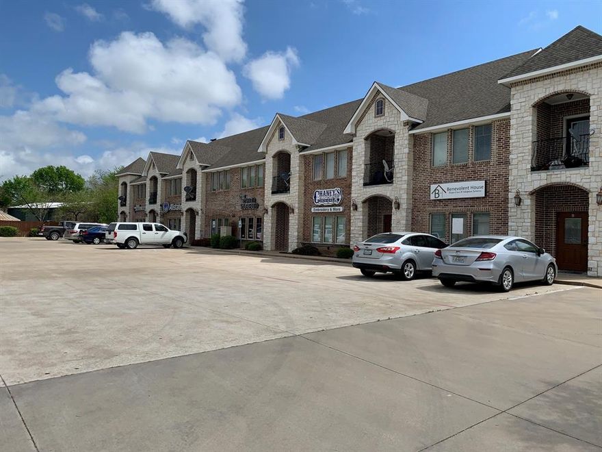 Quiet well kept freshly painted second story apartment.  No carpet, all hand scraped wood floors, ceramic tile in the bathroom.  Granite counters in kitchen and bathroom.  All appliances included.  Off street parking in the rear of the building.  Commercial business spaces are located on the first floor with parking in front of building.