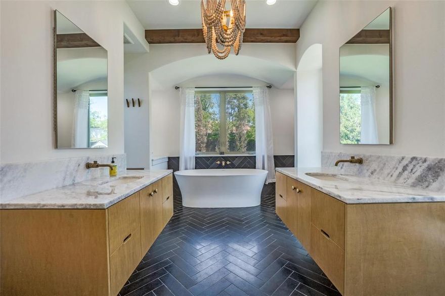 Stunningly reimagined and expanded Designer remodel with modern ambiance and high end finishes. A home you will love to entertain in. Nestled on a very private cul d sac access road w off-street parking. The home offers dramatic open dining and 2 living areas w soaring floor to ceiling windows bringing outdoors in.  It flows into the very generous size family room, that offers beamed ceiling, built in cabinets, place for TV and opens out onto the huge 33 ft covered patio where you will love entertaining, dining or just relaxing. Pool sized yard.  There is a view to behold in almost every room.  Wood floors in lr, dr, family room, br 2, hall.  Luxurious master br w dramatic ensuite bath offer built in cabinets, designer lighting, double vanities, vanity nook. Don't miss the enormous separate shower and garden tub. The master has 2 xlrg WICs  Home office w place for TV, workstation, and even extra space for a  pull out sofabed for stayover guests.This room would also be ideal for a nursery. There is a bathroom-laundry area that sits alongside that offers a large shower, toilet and sink.  Walk or bike to White Rock Lake and Dallas Arboretum.  Neighborhood Jones Park across street.  Go from high tech downton to total relaxation in less than 22 minutes.   Near highly rated private schools.  CLICK ON ICON TO SEE BOTH 360 AND PANORAMA TOURS OF HOME