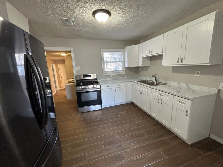 MOVE IN SPECIAL - DECEMBER RENT FREE

Charming Home with Modern Upgrades & Spacious Backyard

Welcome to this beautifully updated home featuring gleaming hardwood floors throughout and a bright, modern kitchen equipped with white shaker cabinets, stainless steel appliances, and granite countertops. The open layout offers comfortable living and effortless flow from room to room.

Step outside to enjoy a large, fully fenced backyard—perfect for pets, outdoor entertaining, or simply relaxing. A single-car garage provides secure parking and extra storage space.

Located in a highly convenient area between Dallas and Fort Worth, this home offers quick access to major freeways for easy commuting, plus you’re just minutes from Lake Arlington, shopping, dining, and local parks.

This home combines comfort, style, and unbeatable location—don’t miss it!