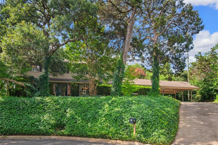 Timeless charm meets functionality in this prime secluded location!  This 4 bedroom, 2.5 bath home offers a thoughtfully designed floor plan with classic appeal.  The 2nd living area functions as a flexible space, perfect for a home office with built in shelving for added convenience. This area was once used to home school.  Complementing its traditional style, this home offers many updates.  The kitchen has been updated with cabinets, corian tops, tile flooring, and gas appliances. Enjoy eating at the breakfast bar, the sunny breakfast area, or the formal dining room.  Step outside to a peaceful backyard that backs up to a lush tree line, offering a sense of seclusion while still being part of a welcoming neighborhood.  For those who enjoy peaceful mornings and evenings, the backyard is a perfect backdrop for relaxing on the back patio.  Just to mention a few of the established plants and trees, dogwood that blooms every year, privet shrub, Hoja Santa, fig ivy, turks cap, yaupon holly, trumpet vine, Peggy Martin Rose vine.  Ground covers include ivy, vinca, Asian jasmine and Virginia Creeper.  Come see this classic and inviting home.