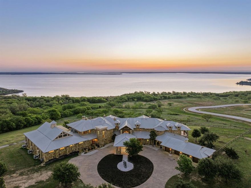 Extremely please to offer the most BREATHTAKING property offered in our 20 year history. 180 degree lake view & you can see for miles of Lake Ray Roberts. The sunsets to the West are incredible with cool breezes coming off the lake. Sunrises to the east are equally impressive rising up over the lake. Adjoins Corp property which comes with over 500 acres of nature to explore and preserves the natural shore line. Approximately 2 mile drive to the marina, 10 minutes to the 20 mile walking and horse trails , 5 minutes to hunting land. Also includes a 1299 SF 2 bedroom guest house and 2,000 SF 6 stables with Horse training facilities.

House is being sold fully furnished along with all Media systems, TVs, full 2 sets of Washer, Dryers, all window coverings, full security system with 1 touch locking of all doors, 14 round party tables and about 200 guest chairs to host most any events. iPad is included for running all media systems, pool, water fall. Pedestrian path to the shore line for fishing, launching small boats.  All information to be verified by buyer.

Note: All measurements are estimates. Buyer to validate.