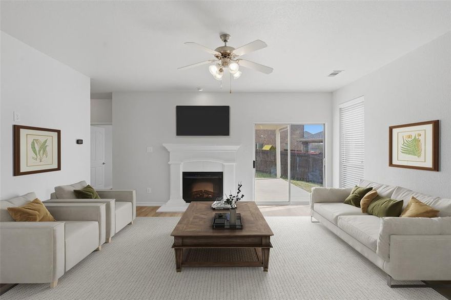 Beautifully updated one story home offering 4 bedrooms, 2 bathrooms, and a dedicated office. Perfect for today's flexible lifestyle. This inviting open concept floor plan features brand new luxury vinyl flooring throughout, freshly painted, updated fixtures, freshly landscaped, creating a modern and move in ready feel. The spacious living room is anchored by a stylish electric fireplace, providing a cozy focal point for relaxing or entertaining. The kitchen and living areas flow seamlessly, ideal for gatherings and everyday living. Additional perks to this home are plantation shutters and build in seating in the breakfast area. Step outside to enjoy a generously sized backyard with a covered patio with plenty of space for outdoor activities, pets, or future enhancements. A perfect blend of comfort, functionality and recent updates, this home is ready for its next owner to enjoy!