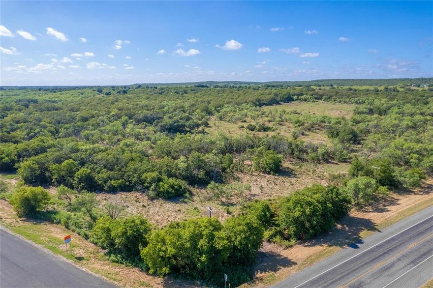 Lot 1 - Discover the enchanting beauty of nature on this picturesque lot boasting over 10 acres of lush landscape in the heart of Central Texas. Lined with majestic live oak, red oak, pecan, mesquite, and cedar trees, this lot is a true sanctuary for nature enthusiasts and outdoor lovers. Situated along the paved HWY 183, with a new entrance for ease of access, Lot 1 offers a prime corner position that sets it apart from the rest. The stunning array of trees provides a natural canopy that adds a sense of tranquility to the surroundings, creating a serene environment for your vision to unfold. With electrical service available and a water well would be required or rural water might be avalible, this lot presents the perfect opportunity to build the home of your dreams amidst the backdrop of thriving flora and fauna. Embrace the great hunting opportunities that await just north of Cisco, TX, where the untamed beauty of nature is right at your doorstep.