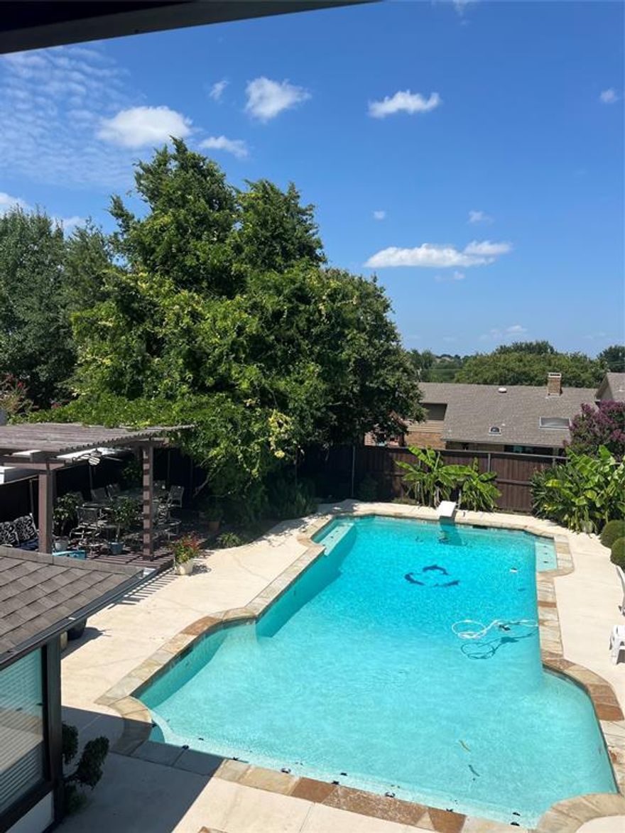 Exceptional Living in Club Hill Estates: Seize the opportunity to own this stunning 4-bedroom, 3-bath residence in Garland, TX. Luxuriate in the expansive living area boasting a freshly updated gas fireplace with an attached wet bar. Unleash your culinary prowess in the well-appointed kitchen featuring a Thermador convection oven, built-in ice maker and microwave, topped with durable Corian countertops. Discover more room to play in the converted garage perfecting as a game or exercise space, with an additional office. Upstairs, find three generously sized bedrooms, additional living space, and a walk-in cedar closet. Outdoor excitement awaits with a large diving pool, separate heated spa, covered seating area, and outdoor kitchen. With the roof and gutters replaced 2022, concrete slab 9x9 shed with electricity and ample room freezer, fridge and lawn equipment, this house ensures practical enjoyment. Contact the listing agent to experience the beauty of this entertainer's paradise first-hand. All information is deems reliable. Buyer and-or buyers agent should do their own due diligence to verify.