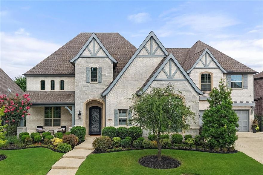 Where timeless elegance meets modern livability, this exceptional residence is a showcase of refined design and luxurious comfort. Thoughtfully curated details include engineered wood flooring, custom lighting, designer finishes, and spacious interiors ideal for both everyday living and elevated entertaining. The chef’s kitchen features professional-grade KitchenAid appliances, a 6-burner gas cooktop, double convection ovens, oversized quartz island, and a well-appointed butler’s pantry. The breakfast area flows seamlessly into a spacious family room with gas fireplace and custom built-ins, all overlooking a resort-style backyard. Each bedroom offers a private retreat with en-suite baths and walk-in closets. The first-floor primary suite boasts dual oversized closets and a spa-inspired bath with freestanding tub, separate vanities, and a dual-entry walk-in shower. A dedicated study with French doors provides quiet space to work from home. Upstairs, enjoy three additional bedrooms, a media room, and a large game room perfect for entertaining. Outside, the custom-covered patio with retractable screens, built-in gas grill, and sparkling pool with water feature create an ideal setting for alfresco dining and relaxing evenings. Additional highlights include a dual staircase, generous storage throughout, a large utility room, and an attached four-car garage. Located minutes from community trails, parks, top-rated Grapevine-Colleyville ISD schools, dining, and shopping. This home must be experienced in person to truly appreciate its style, scale, and sophistication—schedule your private tour today.