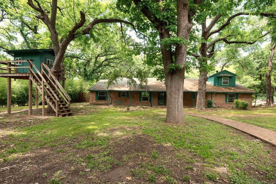 DUNCANVILLE ISD!!!!  Separate Apartment for multi-generational or income opportunity — a truly distinctive property on over half an acre of beautifully treed land offering exceptional space, versatility, and storage throughout.  
TOO MUCH TO LIST ALL THIS HOME HAS TO OFFER....
The property includes a 3,905 sq ft main residence plus a separate 1,240 sq ft, three-level apartment provides flexible space for guests, office, studio, or potential income use.

The main home features 4 bedrooms and 4.5 baths with extensive built-ins in nearly every room. The oversized kitchen provides abundant cabinet and countertop space, room for a breakfast table, and a separate formal dining area. The spacious main living area showcases a wood-burning stove and custom shelving. Additional spaces include a private office with built-ins, a flex room with shelving, and a game room featuring built-in shelves, built-in desk, window seat with storage, and a half bath. Main house also has a back up generator.  

The primary suite offers built-ins, dual sinks, oversized jetted tub, large shower, and an extra-large closet with safe room plus an additional closet. The primary bath connects to an additional handicap-accessible bath also accessible from a secondary bedroom. Upstairs includes a large bedroom with full bath and generous closet.

Outdoor amenities include a screened-in porch, large multi-level deck with gazebo, treehouse with electricity, two underground steel bunkers (vented and solar serviced) each with kitchen and bathroom, and three storage buildings

A rare opportunity offering character, functionality, and unmatched storage. Truly a must-see property.