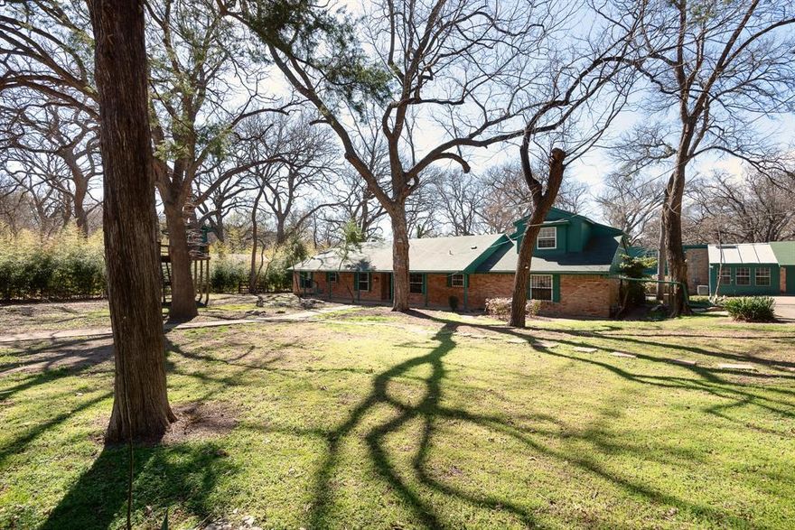 Welcome to 5731 Mona Ln, Dallas, TX — a truly distinctive property on over half an acre of beautifully treed land offering exceptional space, versatility, and storage throughout.

The property includes a 3,905 sq ft main residence plus a separate 1,240 sq ft, three-level apartment provides flexible space for guests, office, studio, or potential income use.

The main home features 4 bedrooms and 4.5 baths with extensive built-ins in nearly every room. The oversized kitchen provides abundant cabinet and countertop space, room for a breakfast table, and a separate formal dining area. The spacious main living area showcases a wood-burning stove and custom shelving. Additional spaces include a private office with built-ins, a flex room with shelving, and a game room featuring built-in shelves, built-in desk, window seat with storage, and a half bath. Main house also has a back up generator.  

The primary suite offers built-ins, dual sinks, oversized jetted tub, large shower, and an extra-large closet with safe room plus an additional closet. The primary bath connects to an additional handicap-accessible bath also accessible from a secondary bedroom. Upstairs includes a large bedroom with full bath and generous closet.

Outdoor amenities include a screened-in porch, large multi-level deck with gazebo, treehouse with electricity, two underground steel bunkers (vented and solar serviced) each with kitchen and bathroom, and three storage buildings

A rare opportunity offering character, functionality, and unmatched storage. Truly a must-see property.