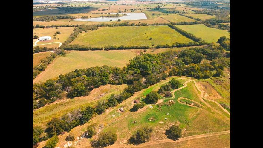 Discover 71 remarkable acres in a highly desirable corridor just minutes from Sanger and convenient to Interstate 35, offering a rare blend of accessibility, privacy, and possibility. This expansive property features gently rolling terrain, open pasture, scattered trees, and a creek corridor creating a natural greenbelt buffer that enhances privacy, wildlife habitat, and scenic character. The low-water crossing and creek area contribute to the property’s charm and natural separation, offering a sense of retreat while serving as a buffer from surrounding growth.

Ideally positioned near town conveniences yet insulated from urban sprawl, this property offers the feel of a private ranch setting with exceptional access for commuting, recreation, livestock, or a future estate. With abundant space to roam and a setting that balances seclusion with connectivity, this is a rare opportunity to own a significant acreage tract in a sought-after North Texas location.