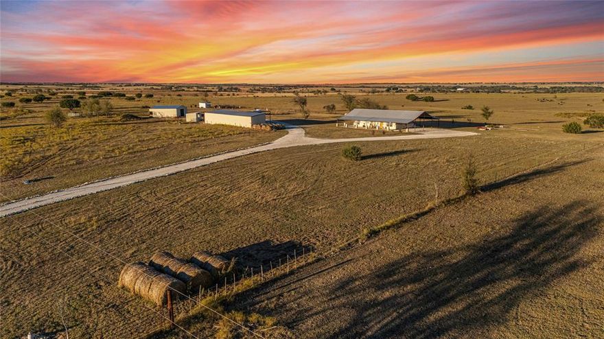 This spectacular Bosque County property offers loads of value, tons of upside, and pulls triple duty as a home, recreational property, and a working ranch; all while offering excellent value in a stellar location!   --   Perched atop gently rolling hills and with the commanding views, the SLR Ranch benefits from its exceptional location and well planned access to its many amenities!   --   The main home is practical but comfy1,500 square foot spread which is both wonderfully livable and chalk full of charisma!  A soaring vaulted ceiling, open kitchen concept, three bedrooms, and even a hidden attic office space which doubles as an escape area for mom; all work in harmony to provide a cozy retreat from a hard day's work on or off the property.   --   Outside, complete wrap around porches ensure sunsets and sunrises aren't to be missed while a fire pit, covered parking for daily use vehicles, and even charming porch swings compliment the home's rugged, practical exterior.   --   Just a stone's throw away, the 72.533 acre property's horse barn, arena, shop, and implement awning sit ready for action whenever the time calls.  A blessing for active parents or those who always want to be in the thick of things, no endeavor is beyond sight from the main home but thanks to exceptional planning of the outbuildings, they don't feel oppressive or on top of one another in the least!  With additional goat pens and turn outs, rounds pens, and a cattle lot; this working property leaves absolutely nothing to be desired!   --   Should you be seeking a property that's just the right size to provide everything you need and nothing you don't, this beautiful Bosque County ranch is certainly worth a visit!  Call or text to schedule a tour today!  Top notch properties that are perfectly sized yet wonderfully livable are few and far between.  Views, great neighbors, and Bosque County sunsets are even more rare.  Don't let this one pass you by!