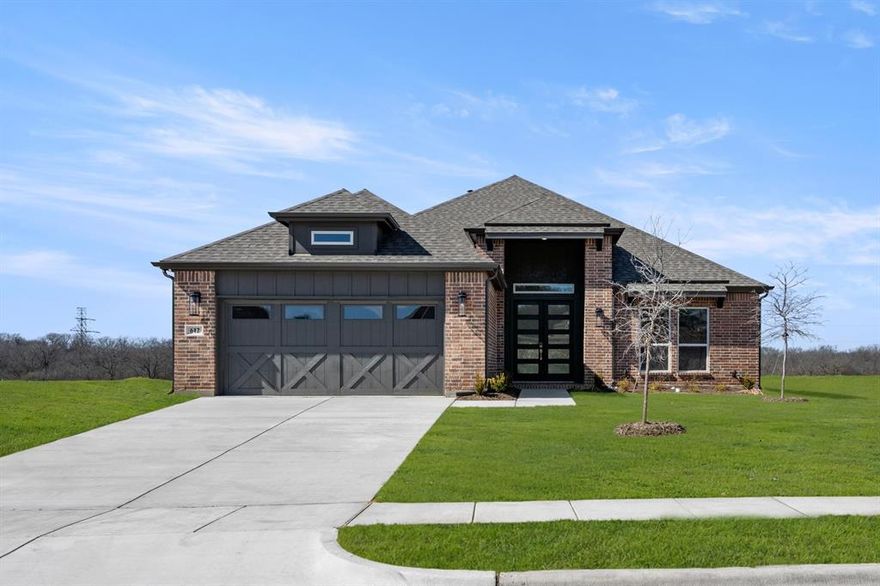 MLS# 21104942 - Built by First Texas Homes - Ready Now! ~ Discover refined living in the Woodford 2 plan at High Country, Phase 2. This spacious single-story home offers 2,619 sq ft with 4 bedrooms, 3.5 bathrooms, and a 2-car garage. The open-concept layout is perfect for entertaining, seamlessly connecting the living area to an expanded covered patio for effortless indoor-outdoor living. Enjoy a contemporary electric fireplace, a private study for work or creativity, and an additional en-suite bedroom for guests or family. Experience modern finishes, thoughtful design, and true comfort—schedule your tour today!