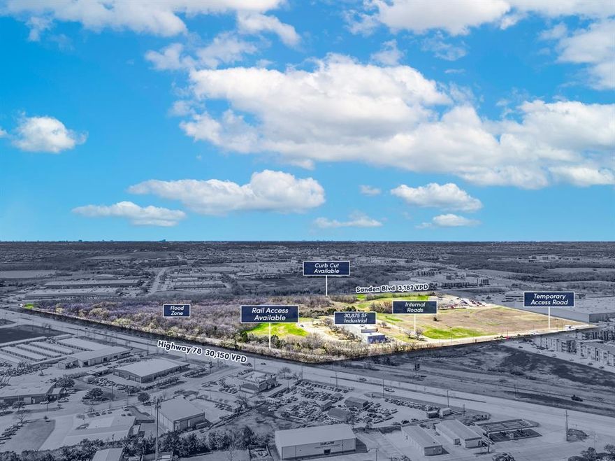 Lot 4 offers 19.88 acres, and Lot 5 offers 38.05 acres, totaling 57.93 acres. Lots 4 and 5 present significant potential for light industrial relocation and development. The property includes a 30,875-square-foot industrial space, temporarily accessible via the rear (west end) of the site, behind Sanden USA. The new owner will need to coordinate with the City of Wylie to establish a new access point through the available curb cut on Sanden Blvd. With approximately 26.56 acres in floodplain, the property offers approximately 27.57 buildable acres, along with on-site rail access and the potential to establish a stop for shipping and distribution through the Wylie Intermodal Terminal.

Located on Lot 5, the property features a 30,875-square-foot industrial building that includes office space and four divided warehouses with clear heights ranging from 16 to 25 feet. The facility is equipped with 3-phase heavy power (480 volts), two loading docks, and three grade-level doors, all with automatic overhead doors. Additional features include an overhead crane, ventilation system, spot coolers, a dock leveler, and a service pit. 
The front portion of the building offers built-out office space, fully HVAC-equipped with fire sprinklers. The office area includes four restrooms, open office space, a conference room, private offices, and a lobby with direct access to the shop area. Chillers and air compressors on-site are available for negotiation. 

The building sits on approximately four acres and offers ample parking for employees, with internal roads surrounding the structure. Previously used for die-casting manufacturing, the site presents a variety of potential uses, including product manufacturing, automotive-truck services, light distribution, and more.

Just south of the building offers rail access to the Wylie Intermodal Terminal. There is potential to develop a station to fit distribution needs, if necessary. (Not confirmed)