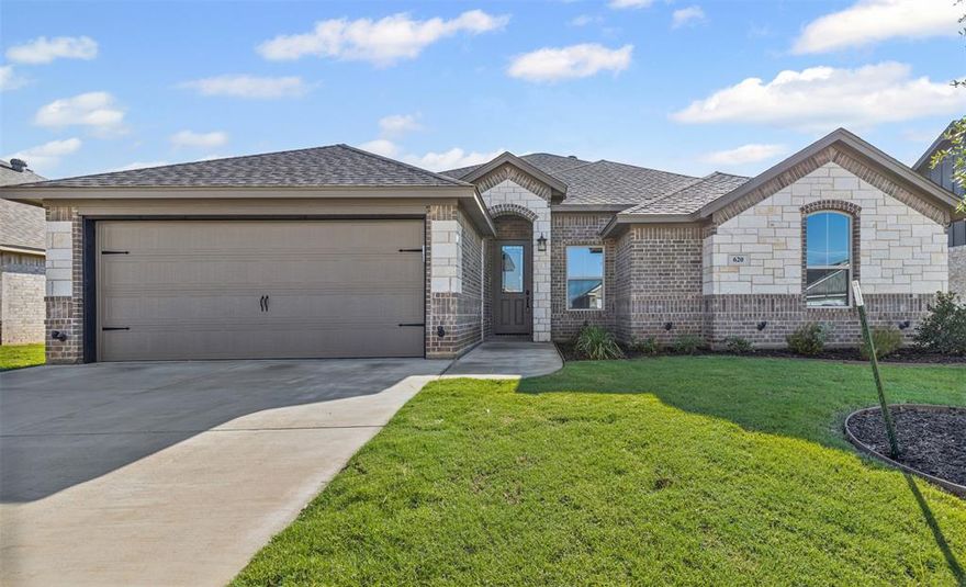 SAVE $3,000 toward closing costs, a rate buy-down, or whatever works best for you! Discover the perfect blend of modern design and energy efficiency in this stunning Al Couto Homes build, located in sought-after Boardwalk Estates. Thoughtfully crafted with high-end finishes, this open-concept layout features wood-look tile floors, detailed crown molding, and soaring ceilings that create a bright, welcoming atmosphere. The spacious living room showcases a striking stone fireplace and flows seamlessly into the gourmet kitchen, complete with granite countertops, stainless steel appliances, and a dining space ideal for gatherings. The owner’s suite offers a private retreat with dual sinks, a granite vanity, walk-in shower, soaking tub, and a generously sized walk-in closet. A split-bedroom floor plan ensures added privacy with secondary bedrooms set apart from the primary suite. Step outside to enjoy a covered patio overlooking the fully fenced backyard—perfect for relaxing or entertaining. Built with efficiency in mind, this home is equipped with FOAM insulation, a high-performance Trane HVAC with heat pump, and a finished garage with epoxy flooring prewired for an EV charger. Experience quality, comfort, and energy savings in this exceptional home. No HOA, Low Tax Rate, No PID, No MUD.