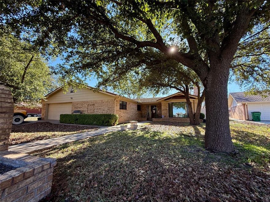 1401 W. Hill Lane  Coleman, TX 76834

Spacious and well-appointed, this four-bedroom, three-bath home sits in one of Coleman’s most desirable neighborhoods—up on the hill—and offers comfort, functionality, and excellent curb appeal.

The heart of the home is the newly updated kitchen, featuring granite countertops, laminate flooring, a black and stainless gas stove, dual stainless sink, abundant cabinetry with built-ins, matching black dishwasher, refrigerator, and trash compactor, plus a stainless built-in microwave. An eat-in bar provides additional seating and makes the space ideal for gathering and entertaining.

The kitchen flows seamlessly into the open-concept living and dining areas, highlighted by a large brick fireplace and oversized windows that overlook the beautiful backyard and allow for abundant natural light. Just off the living room is a dedicated entertainment area, perfect for musical instruments, a sitting space, or hobbies, enhanced by a large picture window.

This home offers a split-bedroom arrangement for added privacy. The primary suite includes an attached office area and private bath. A second wing features two bedrooms and a full bath, while the third wing offers a large bedroom with a walk-in closet, a craft room or workshop with direct access to the backyard, and a spacious bathroom with a jetted garden tub, walk-in shower, and linen storage.

Additional features include a full-size laundry room and an oversized garage with built-in shelving on both sides.

Outside, the property is beautifully maintained with a screened-in porch, landscaped and fully fenced backyard, storage building, and mature pecan trees. The front of the home boasts outstanding curb appeal with large oak trees, sidewalks leading to the street, mailbox, and driveway.

A wonderful home in a quiet, established neighborhood—this property offers space, versatility, and charm both inside and out.