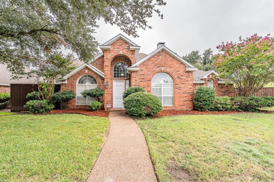 Welcome to this spacious, updated home in a desirable Flower Mound subdivision with an HOA and wonderful curb appeal. Designed for comfort and functionality, this house has plenty of space to make it your own. The front door opens to a bright formal living room with plantation shutters, while the formal dining is just across the entry and connects directly to the kitchen. The kitchen has an island with an electric cooktop, a true pantry, built ins with a desk area, and a breakfast bar that opens to the main living room. The main living area feels like the heart of the home with a wood burning fireplace, custom built ins, and big windows looking out to the backyard. The primary suite is downstairs, featuring a spacious bath with two vanities, a soaking tub, a walk in shower, and a large walk in closet. A half bath for guests and a laundry room with built ins are also on the main floor.
Upstairs is a game room or a third living area, a large storage closet, and two bedrooms with ceiling fans and good sized closets, along with a full bath that includes dual sinks and a shower tub combo. Step out back to enjoy a large covered patio, perfect for entertaining, a play set, a storage shed, and plenty of yard space for pets to run or to start your dream garden. The oversize garage even has a bonus unfinished storage room with a ceiling fan and lights—perfect for holiday storage or a hobby space. Recent updates like light paint, new countertops, appliances, flooring, fixtures, and refreshed bathrooms mean there’s not much left to do but move in and start enjoying.