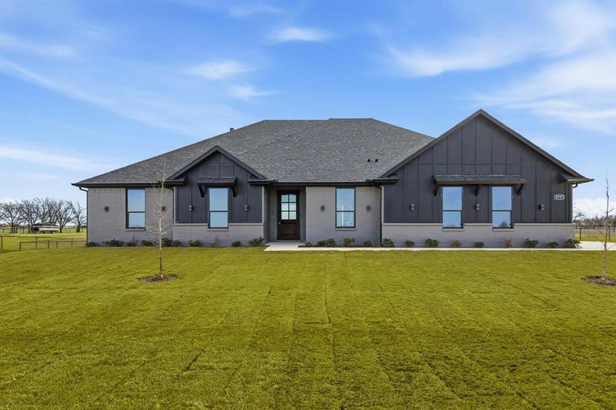 Just listed in Krum ISD’s sought-after Indian Trail Estates and available now! This brand-new, move-in-ready home features an open-concept layout with quartz countertops, stainless steel appliances, and custom finishes throughout. Designed with flexibility in mind, the floor plan includes a spacious primary suite plus a second primary mother-in-law suite. Situated on over an acre, the property offers a large backyard, outdoor kitchen, and full spray foam insulation for maximum energy efficiency. Enjoy unmatched freedom with NO HOA, NO city taxes, and NO MUD or PID. The builder includes a one-year bumper-to-bumper warranty along with an additional 2-10 warranty at no extra cost. This highly desirable and functional layout delivers peaceful rural living with convenient access to Denton’s vibrant Rayzor Ranch—just 20 minutes away for shopping, dining, and entertainment. Schedule your showing today!