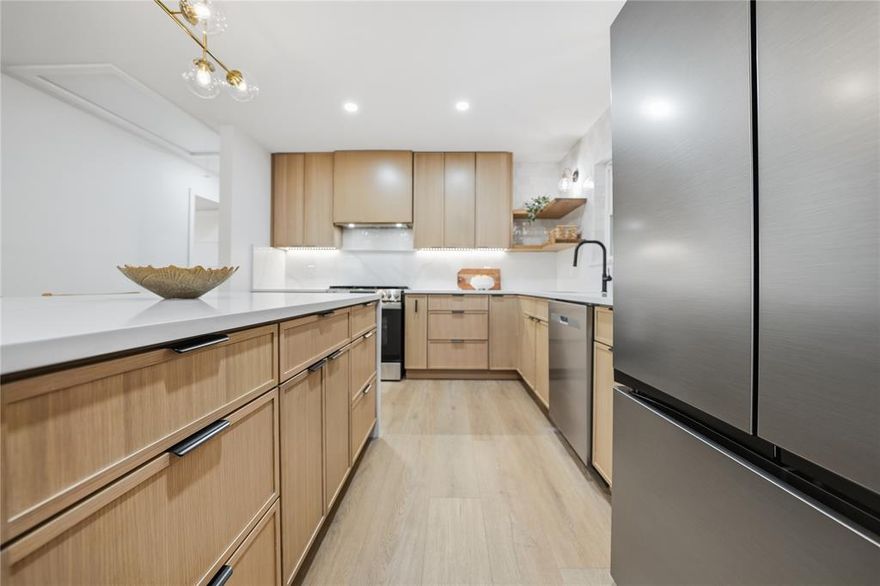 Experience refined living in the sought-after Lochwood neighborhood. This fully remodeled home, designed by Together Design & Build, offers an open-concept layout, a high-end designer kitchen, 3 bedrooms, 2 bathrooms, and a 2-car garage. Thoughtfully redesigned with premium materials and modern finishes, this home seamlessly blends style, comfort, and functionality. Step inside to an inviting, light-filled layout enhanced by large picture windows and a seamless flow between the living, dining, and kitchen areas. The gourmet kitchen is a true showstopper, showcasing custom white oak cabinetry, quartz countertops with a beautiful backsplash, a waterfall eat-in island, a gas cooktop, and all-new stainless-steel appliances. A spacious pantry offers additional cabinetry for extra storage, while the utility room includes a stackable washer and dryer along with a convenient sink. The primary suite provides a serene retreat with a walk-in closet and a luxurious ensuite bath featuring a walk-in rainfall shower surrounded by floor-to-ceiling tile. Two additional bedrooms share a sleek, modern bathroom, making the space ideal for guests, family, or a home office. LVP flooring flows throughout the home, complemented by stylish tile in the bathrooms. Outside, enjoy a spacious backyard with newly installed sod, a brand-new privacy fence, and a custom-built fire pit - perfect for entertaining, relaxing, or enjoying quiet evenings outdoors. Ideally located near White Rock Lake’s walking and biking trails, walking distance from Lochwood Park, featuring new pickleball courts, wooded trails, tennis courts, and playgrounds. Just minutes from Dallas Arboretum, Lakewood, Lower Greenville, Casa Linda, and Lake Highlands, and the brand-new Martha Turner Reilly Elementary, offering easy access to major highways, shopping, dining, and entertainment, this exceptional home delivers the perfect blend of luxury and convenience. Schedule your tour today!