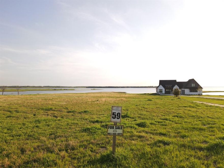 Welcome to 405 Sailview Ct, Honey Grove, TX 75446, also known as Lot 59, your opportunity to own 1.88 acres of prime lakefront property on beautiful Bois d’Arc Lake. This exceptional homesite offers the rare advantage of being boat dock capable, combining convenience, space, and luxury in one of North Texas' most desirable new lakefront communities. Whether you're envisioning a peaceful vacation home, a family-friendly retreat, or a high-potential investment property, this lot provides the flexibility and appeal to meet your goals. With short-term rentals allowed, it’s also ideal for those looking to generate income while enjoying their own slice of lake life. A newly completed home next door offers a real-world glimpse into the quality and charm of this neighborhood, giving you a clear sense of the custom home you could build here.

The Peninsula community made waves when it sold out in under 30 minutes during its May 2023 release. Residents enjoy access to a stunning multi-million dollar clubhouse featuring an infinity pool, a fitness center, a putt-putt golf course, outdoor grilling stations, and much more. Continued development is underway, with future amenities including a multi-sports field, a kayak and paddleboard launch, a fenced dog park, and multiple community marinas. The Shores at The Peninsula is also moving forward, with the first community boat slips already under construction and more amenities expected by summer. From Lot 59, you'll take in sweeping views of Bois d’Arc Lake, the planned Belle Vie and Five Points communities, and the expanding amenity area of The Shores at The Peninsula.

This is your chance to be part of an exclusive lakeside community that’s quickly becoming one of the most sought-after destinations in North Texas. Don’t miss out on the opportunity to own at Bois d’Arc Lake and experience a lifestyle that blends natural beauty, luxury living, and lasting value.

Buyer to verify all information*