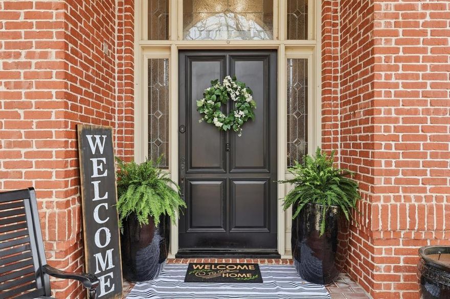 Discover a gorgeous custom home in Colleyville, perfectly positioned overlooking a private neighborhood park and pond. This residence boasts high-end updates throughout, including gas lanterns at the entry and stunning hardwood floors. The grand entry features an ornate iron staircase and a chandelier with a lowering feature for easy cleaning. The kitchen is equipped with premium appliances such as a Sub-Zero refrigerator and Bosch stainless steel dishwasher, complemented by granite countertops and travertine flooring. The gorgeous floors extend through the open concept dining and den area with fireplace as well as to the large utility room with built-in icemaker and room for a second refrigerator. This luxurious home offers five spacious bedrooms with walk-in closets, five full baths and a half bath. The primary suite is a true retreat, showcasing designer finishes, chandelier, cove lighting and a coffee bar. The primary bath is a royal oasis with heated marble flooring, heated towel bar, an air bathtub with remote control, and dual showers with steam features finished in marble. You will love the designer wardrobe, with pull-out drawers, glass doors,and floor to ceiling storage capacity. Three other second floor bedrooms, one with a full ensuite and the others with a jack-and-jill bath are found on the second floor. While a guest suite with pool views is conveniently located on the ground floor with adjacent full bath. Outside, enjoy your private backyard oasis featuring an inground pool and spa with water features, a fire pit surrounded by black lava rock, a large bench swing, and professionally landscaped grounds. One full bath includes direct patio and pool access – great for your summertime guests.  Schedule your private tour today to experience this stunning property!