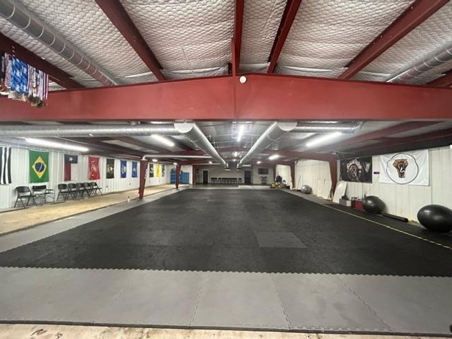 LOCATION, LOCATION, LOCATION !   Commercial building located in the heart of Downtown Whitewright on huge paved .57 corner lot that offers 8400sf under roof with 3 separate interior functioning areas to conduct business. Multi use, Income producing property with current tenant being that of Sindwinder Brazilian Jiu Jitsu Martial Arts School that occupies the complete building until 2026 with lease in place. Fully remodeled in 2021 included new roof, electrical, plumbing, spray foam insulation, roll insulation, walls and flooring in office and multiple restroom areas, 3 separate HVAC units. 3 separate electrical meters.  The asphalt parking area can hold 35+ vehicles with ease. No showings scheduled after 5 pm due to open class times. Great investment property potential to a growing community in Grayson County located 20 minutes from Sherman and easy access to Hwy 121 and the MetroPlex.  Growth is on its way.