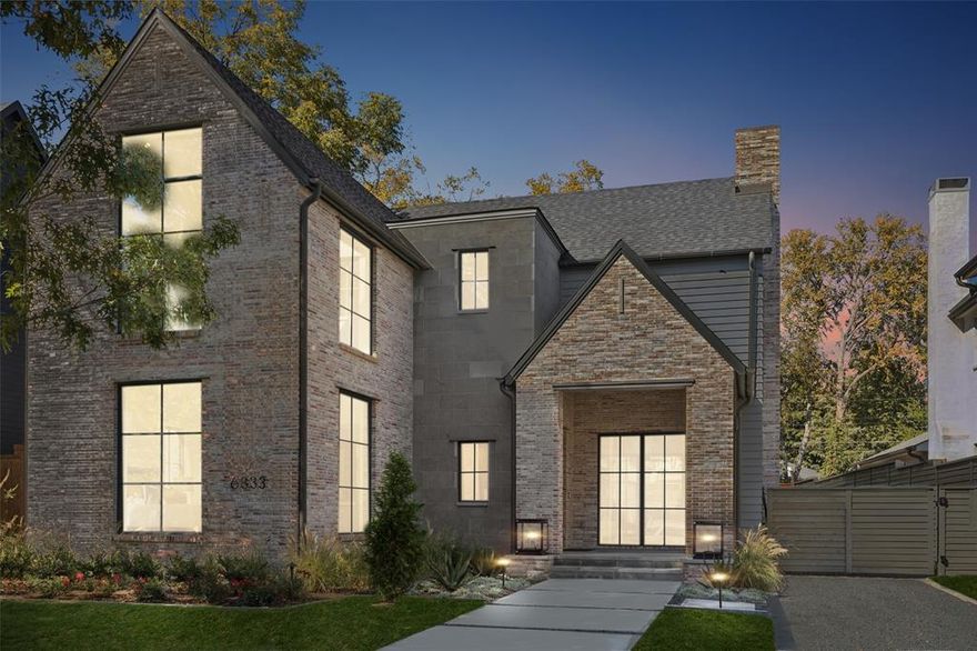 Nestled on a quiet, tree-lined street in the heart of Lakewood, this stunning new construction by Dallas Newport Group combines timeless curb appeal with thoughtful modern design. A welcoming front porch leads into a bright, open layout where the kitchen, dining, and living spaces flow seamlessly together. The kitchen is a true showpiece, featuring a built-in refrigerator, abundant custom cabinetry, a scullery, and a butler’s pantry that connects to the formal dining room—perfect for entertaining. Walls of windows and sliding glass doors fill the main living area with natural light and open to the covered patio, complete with a cozy fireplace and built-in grill for year-round enjoyment. A secondary living space at the back of the home offers flexibility as a den or private office, while a first-floor guest suite with an ensuite bath provides comfort and privacy for visitors. Upstairs, the oversized primary suite offers a luxurious retreat with a spa-inspired bathroom featuring dual vanities, a soaking tub, a spacious dual-head shower, and a custom walk-in closet with built-ins. Three additional bedrooms, each with ensuite baths, a full-size laundry room, and a large upstairs living area complete the second level. With meticulous craftsmanship, modern finishes, and an ideal Lakewood location, this home blends sophistication, comfort, and functionality in every detail.