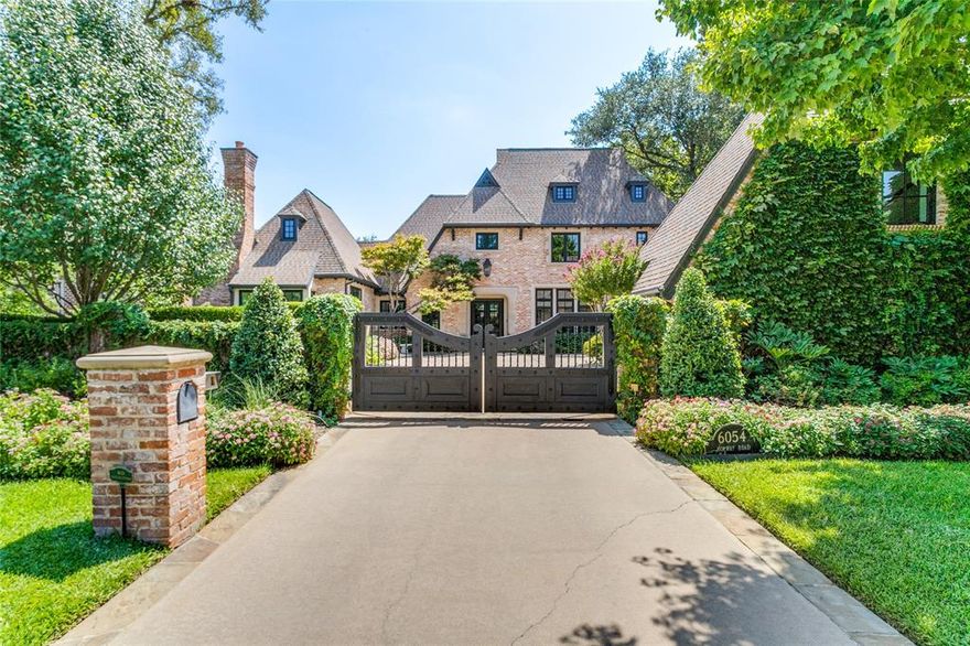 Discover your storybook haven in Preston Hollow! This enchanting 6-bedroom, 5.2-bathroom estate, Originally designed by Robbie Fusch and extensively renovated by Susan Newell in 2020, this home blends timeless elegance with modern luxury.  The first floor features three living areas, primary and guest suite, and a stunning kitchen with Sub-Zero and Wolf appliances. Wooden beams and custom details add charm to sleek modernity. A loggia leads to a backyard oasis with pool, spa, and cascading water features. Upstairs, find three bedrooms, and a game room connecting to a flexible guest apartment with private staircase and garage. This tech-savvy home features a Savant audio visual system, built-in speakers, and smartphone-controlled security, pool, lighting, and appliances. Gated for privacy, this gem offers a picturesque front garden, three-car garage with epoxy floors, and upgrades including landscape refresh and automated window coverings.