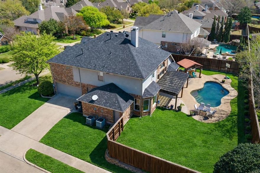 Upgrades Galore $135k+…Exquisite NORTH-facing Goodman home situated on a premium oversized corner lot, offering exceptional curb appeal with a striking two-story brick and stone elevation, manicured landscaping, and a desirable side-entry 3-car garage.

This beautifully updated 4-bedroom, 3.5-bath residence showcases a thoughtfully designed floor plan with elegant finishes and spacious living areas throughout. The home features soaring vaulted ceilings in the living room and high ceilings in the family room, creating an open and light-filled ambiance enhanced by expansive windows. Hand-scraped hardwood floors on the first floor and engineered wood on the second floor. NO CARPET in the house.

The newly and tastefully renovated kitchen is a true centerpiece, featuring quartz countertops, upgraded appliances, and a functional layout ideal for both everyday living and entertaining. ALL bathrooms have been fully renovated with modern, upscale finishes, including a spa-inspired primary bath designed for relaxation and comfort.

Additional highlights include a private office, an upstairs media room, and generous storage throughout. 3rd garage bay used for storage with door to master - can easily be reverted.

Step outside to a resort-style backyard oasis complete with a sparkling POOL, outdoor kitchen, and ample space for entertaining or enjoying quiet evenings.

Located within a highly rated school district and offering convenient access to major freeways, this home provides easy connectivity to Downtown Dallas, DFW International Airport, and Love Field.

A rare opportunity to own a move-in ready, extensively upgraded home in a prime location.