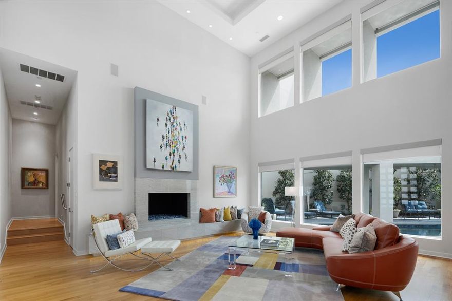 Sleek contemporary modern home designed by Quorum Custom Homes in the quiet, desirable Preston Forest neighborhood. Boasting clean lines and elegant lighting throughout, this architecturally unique home was thoughtfully designed for entertaining. Grand entryway welcomes you into the living room featuring soaring ceilings, maple flooring, and massive bay windows overlooking the pool and courtyard. Kitchen highlighted by a gorgeous waterfall quartz island. East wing features private office, gym, and master suite with vaulted ceilings and oversized closets. Take the elevator to the 2nd floor with lounge space and wet bar overlooking the living room; private theatre room, 3 bedrooms, game room, and 25' balcony. Maple flooring throughout first floor. Custom wet bar and wine closet off of dining area. Mother-in-law or Guest suite privately located in West Wing. Kitchen with Quartz waterfall island and backsplash; Miele, Bosch, and Wolf appliances, warming drawer, built-in coffee maker, and dishwasher.