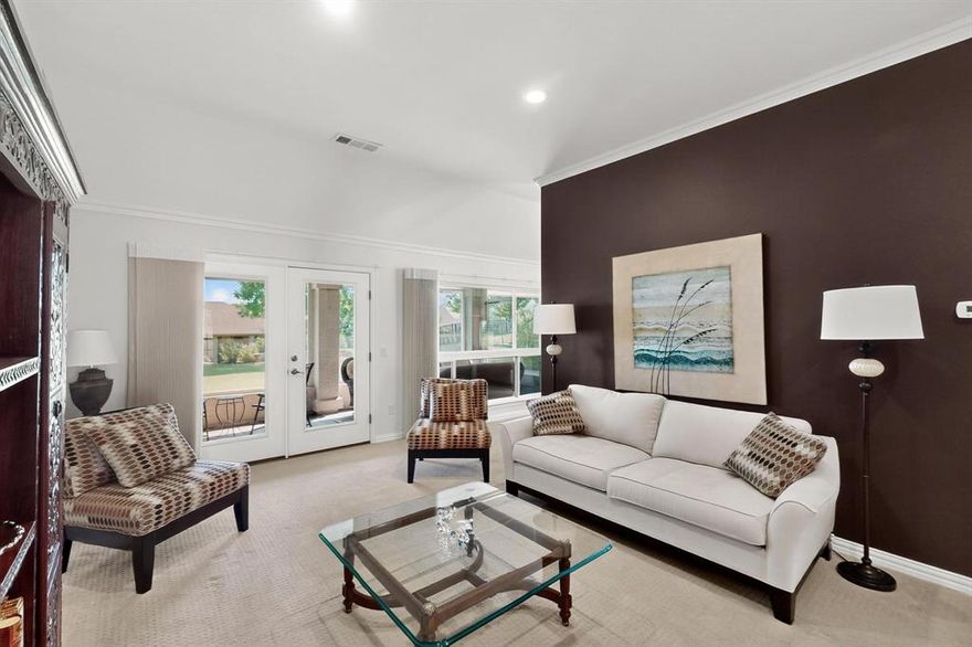 Charming 3-bedroom Trova with extended golf cart garage and greenbelt views. This home welcomes you with a paver walkway lined with a stone bench. 

Step inside to a light-filled formal living room that opens directly to the enclosed, screened-in patio—ideal for relaxing while overlooking the expansive greenbelt and oversized lot. The bright kitchen features crisp white cabinetry, granite countertops, a decorative chandelier, and a refrigerator that conveys. Enjoy casual meals in the sunny breakfast nook with bay windows, built-in seating, and extra storage.

Adjacent to the kitchen, the spacious family room offers flexibility for a second dining area and opens to a generously sized stamped concrete patio—perfect for entertaining or enjoying the peaceful outdoor setting.

The primary suite is a true retreat with a tray ceiling, bay window showcasing greenbelt views, and private access to the enclosed patio. The en suite bath includes dual vanities with a center vanity, shower with grab bar, and a large walk-in closet.

Two additional bedrooms are located at the front of the home, each with plantation shutters and sliding door closets, conveniently served by a full hall bathroom.

A dedicated office with built-in cabinetry and desk offers a quiet space to work or create. The laundry room includes a sink, upper cabinets, and room for side-by-side appliances. The extended golf cart garage adds valuable storage and utility.

Best of all, it is in close proximity to the amenities, including two state of the art sports centers, tennis, pickleball and nearly complete bocce court. Explore your creative side at the creative arts center, and engage in the community at the Clubhouse.