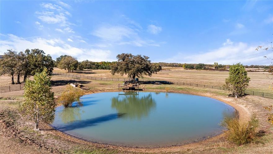 Stephenville Show Place is a 281 acre ranch with an amazing 2-story custom home. This is a gorgeous 2-story home with large porches and a beautifully landscaped yard overlooking a resort-style diving pool. Inside you will not be disappointed with this open floor plan and the high-end finishes throughout. Granite counter tops in the kitchen and engineered hard wood throughout the living area make this ideal for family gatherings or parties. The isolated master bedroom offers a nice restful space with a large walk-in closet that is a safe room in bad weather. The upstairs offers a large media room with a convenient bathroom and spare bedroom. Relax on the back porch, which is connected to the pool, and a great outdoor kitchen, complete with a full bathroom. This is a showstopper of a ranch with 9 tanks and numerous wells to keep the tanks full. These showplace ranches don’t come to market often and this one does not disappoint.
