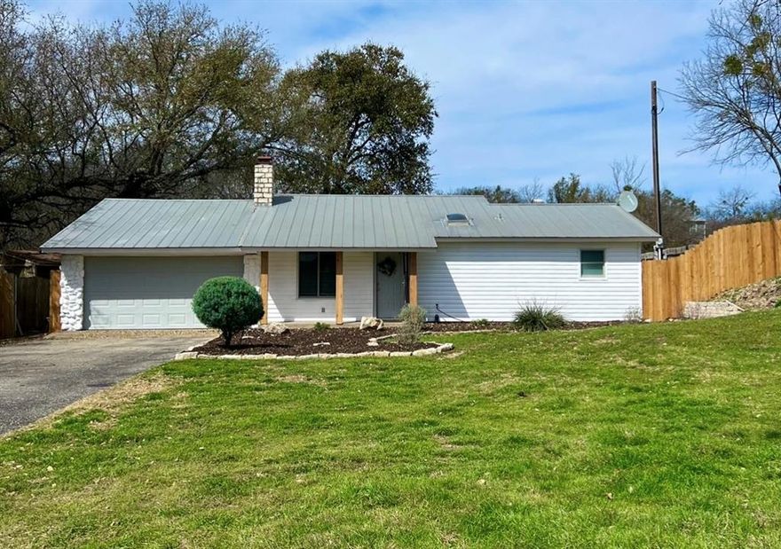 This waterfront home offers a perfect place for AIRBNB or a permanent home with its serene outdoor living. The interior boasts new floors installed in 2020, providing a fresh and stylish foundation throughout the living spaces. The HVAC system, upgraded in 2021, ensures optimal climate control, making the home comfortable year-round. New windows installed in 2021, allowing natural light to flood the interiors while maintaining energy efficiency. A bathroom that feels modern, elevated with a bright walk in shower. Fresh exterior paint. The waterfront experience is elevated with a newly constructed boat dock and lift, as well as 2 complete with jet ski lifts, added in 2021. New luxury vinyl plank floors throughout the home. Moving outdoors, a cozy patio area awaits, featuring an outdoor bar seating, fire pit and an outdoor grill. This space is designed for relaxation and entertaining all of your guests year round. Fish straight off your back porch!! This property features additional office, perfect for those who work from home. For those who want to master their craft. A detatched workshop by the water provides an ideal retreat and work space. 220 plug and dump station for RV by garage.