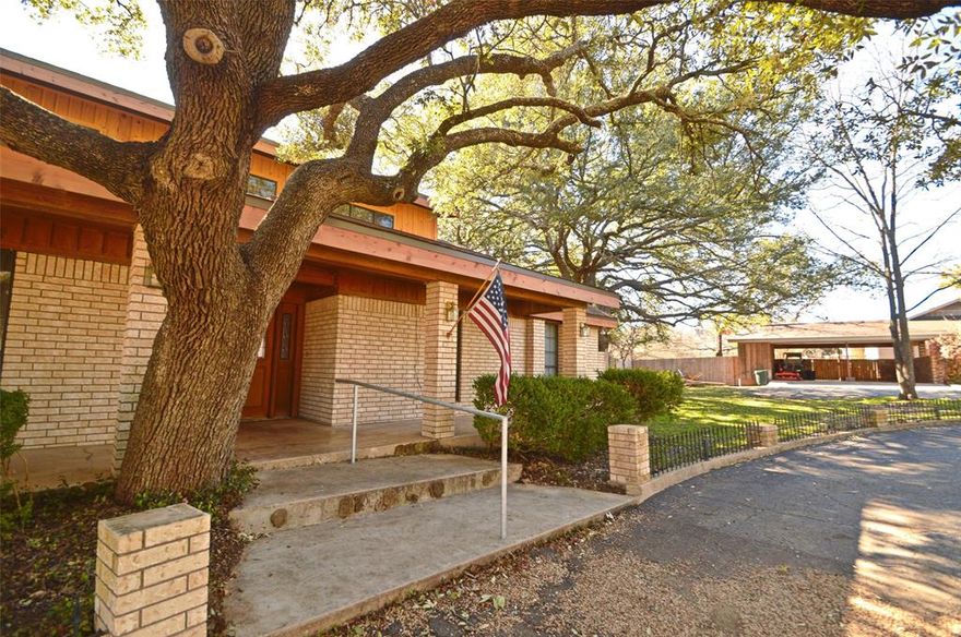 3.5% to Buyer's Agent. SELLER MOTIVATED! $10,000.00 Renovation allowanee to Buyer!  Great estate home, wonderful architectural design. Convenient location,close to golf course, close to restaurants, entertainment. Great lot, large beautiful trees! Built in 1985, custom woodwork, built in cabinets, sunken living area, brick wood burning fireplace, wet bar, vaulted ceiling, beams, windows overlooking in ground pool and private back yard. Large kitchen, double oven, cook top, opens with breakfast area. Spiral stair case leads to open loft game area. Large utility laundry room with sink. Two bedrooms and two baths. Large master and bathroom, 2 separate vanities, separate shower, walk in senior tub, two walk in closets. Recent roof, exterior wood replaced. Large party deck built over 2 car carport and storage area overlooking pool!  Separate guest house, recent metal roof, needs renovation.  It has 2 bedrooms, 1.5 baths, some hardwood floors! Cute little farmhouse, approximately 1200 sq. ft