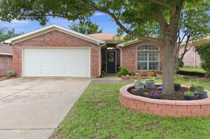 You will be enamored by this rare, one owner, brick home backing to a heavily treed green belt with a gently flowing river! Perfect for gardeners who love to soak in the privacy and peaceful solitude of the rich green canopy of lush trees and vegetation while sipping coffee on the quaint stone patio with its handsome pergola, reveling in the quiet beauty. You will appreciate all the upgrades in the extended kitchen highlighting granite countertops and updated backsplash, additional upper cabinets, undermount sink and pendant lighting. Take in the extensive vinyl flooring in entryway, living area, all bedrooms, kitchen, and breakfast nook. A wall of windows in the living and breakfast areas perfectly frames the unique outdoor charm. Primary suite has its own private French doors to the enchanting patio and garden sanctuary! Storage shed for your lawn and gardening equipment, too! Oh, yes, NO HOA!
Ensuite bath features separate shower and soaking tub, large window for additional natural light and a sizeable walk-in closet. 
Split floorplan ensures more privacy with the secondary bedrooms separate from the primary and both include lighted ceiling fans. 
Fantastic location near the Tarrant County College, the Stockyards, Eagle Mountain Lake, and Fort Worth’s Nature Center and Refuge. Easy access to Hwy 820, 199, and I-35. Full list of upgrades and maintenance in transaction desk documents.