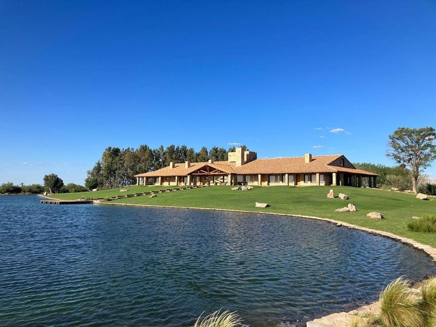 Premier Agricultural & Livestock Estate, Turnkey Operation with Premium Water Rights Exceptional opportunity: 2,475 hectares (6,117 acres) of highly productive land with top tier infrastructure. Features 475 hectares (1,174 acres) of premium farmland and 2,000 hectares (4,942 acres) ideal for cattle or agricultural conversion with irrigation. Currently used for forage crops, with strong potential for horticulture and fruit. Includes 9 electrified wells (6 active), definitive irrigation rights for 573 hectares (1,416 acres, 3,087,490 sqft) and provisional rights for 1,186 hectares (2,931 acres, 4,994,730 sqft). Highlights: Feedlot for 4,000 head with pens, scales, chutes, and full forage byproduct storage. Machinery sheds, barns, and workshop with maintenance pit. Full perimeter fencing and internal divisions. Main Residence (Chalet): Luxury home with 6 suites, living room, dining room, 2 kitchens, garage, basement, tennis court, golf green, stables, lagoon, and landscaped park. Includes electric generators, reverse osmosis system, and premium furnishings. Additional Housing: 2 estate homes, 3 staff residences, and 4 worker houses, all well-maintained. Crops in Production: 30 hectares (74 acres) of Malbec vineyards (pressurized irrigation, partial hail netting). 20 hectares (49 acres) of Chandler walnuts (gravity irrigated). 50 hectares (124 acres) with pressurized irrigation, formerly poplar grove. Water Infrastructure: 9 deep wells (6 in operation) and an Australian-type reservoir with 6 million liters (1.58M gallons) capacity. A rare turnkey asset offering scale, water security, and sophistication in one of South America's most fertile regions. Broker Disclosure: The broker and its associates are not responsible for the accuracy of measurements or information provided in this listing. Buyer and their representatives to independently verify all details, including but not limited to, property dimensions, features, and other pertinent information.