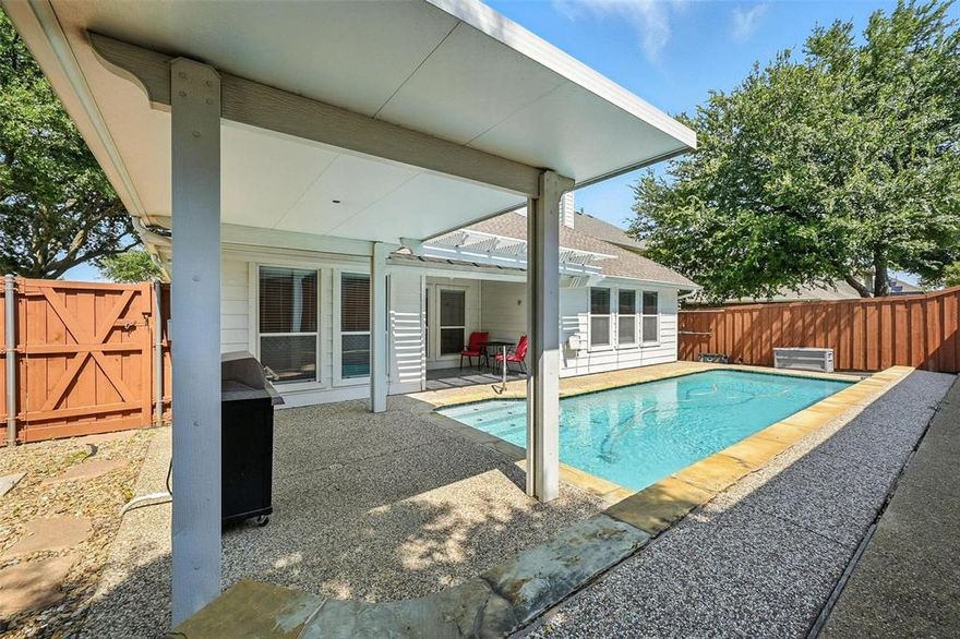 Charming and versatile home in sought-after Craig Ranch with a private pool! The open-concept living room, kitchen, and breakfast area offer gorgeous views of the sparkling backyard saltwater pool and covered patio—perfect for relaxing or entertaining. Enjoy low-maintenance living with adorable curb appeal, right across from a lush green park. Kitchen boasts a huge island with a breakfast bar with granite countertops. The spacious primary suite boasts a wall of windows, a luxurious soaking tub, dual vanities, and a large walk-in closet. Stacked formal living and dining areas provide endless options—use them as elegant entertaining spaces, a home office, game room, or playroom. Just two blocks from the neighborhood pool and park, with highly rated Frisco ISD schools. Conveniently located near multiple major highways, shopping, and dining.