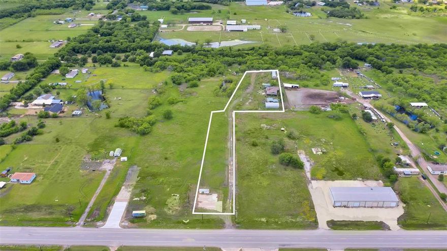 MOTIVATED SELLER! Great location off of SH 205 for COMMERCIAL DEVELOPMENT. High traffic and high visibility location in one of the fastest growing areas between Rockwall and Terrell, TX. The orange stakes in the front of the property designate the land that has been acquired by TX DOT for the 205 HWY expansion.  With great exposure on SH 205 this could be an incredible opportunity for business or development future site with City services in place. The property has 2 mobile homes on site as well as a 1500 sq ft barn with electric, currently being used for storage (will stay with the property after sale). DON'T MISS THIS OPPORTUNITY TO BE PART OF GROWTH BETWEEN ROCKWALL AND TERRELL.